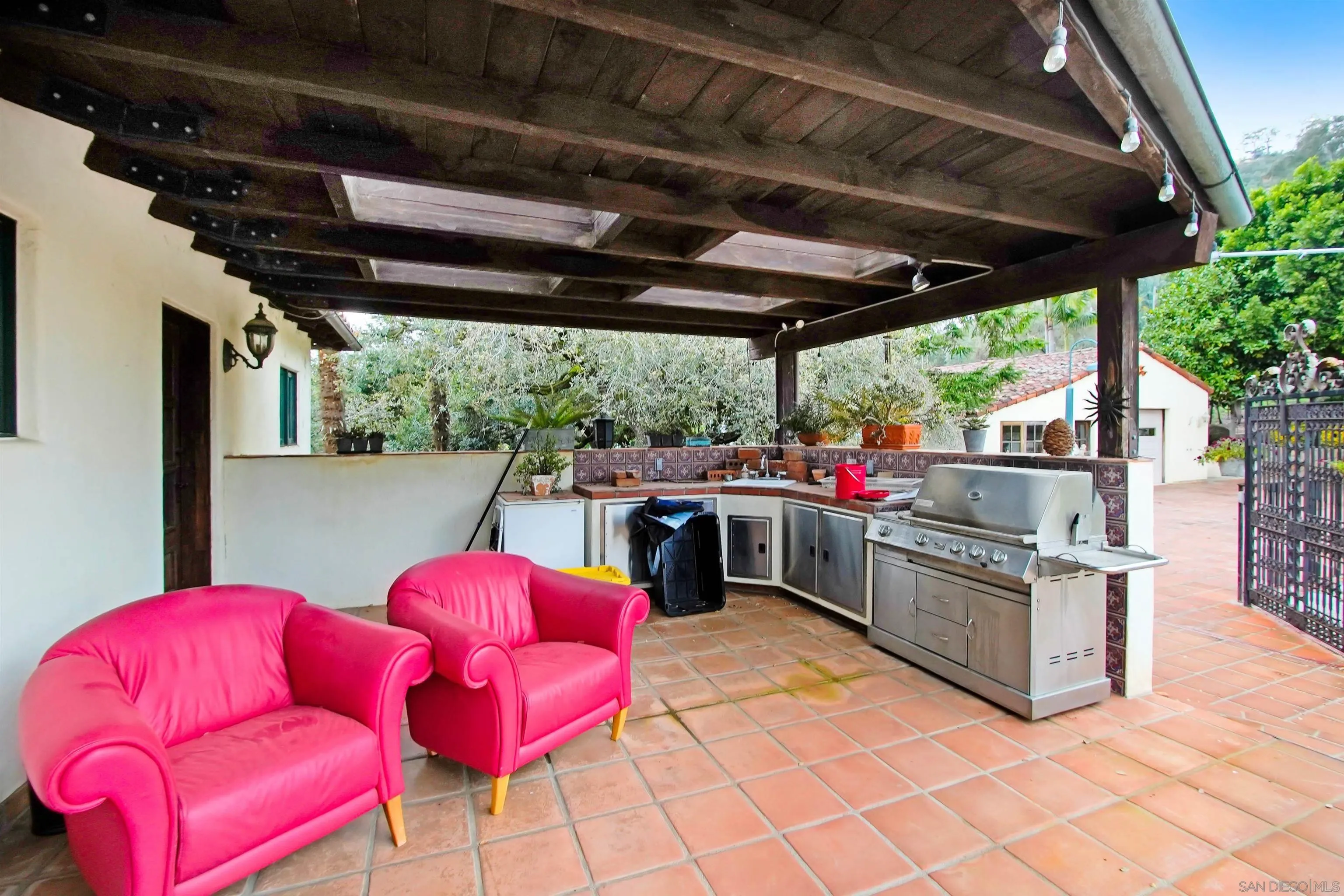 16757 Old Guejito Grade Road Escondido, CA 92027 - Photo 17 of 38 a view of kitchen with stainless steel appliances granite countertop a barbecue grill and a chairs