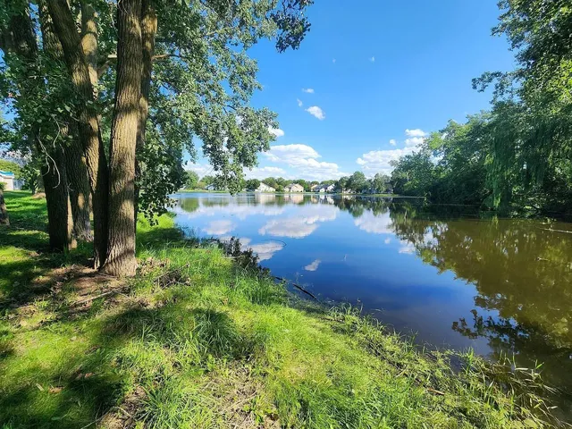 a view of a lake with a building in the background
