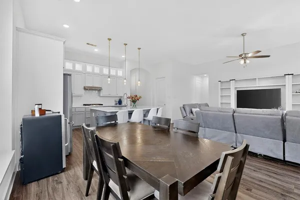 a view of kitchen and dining area with furniture