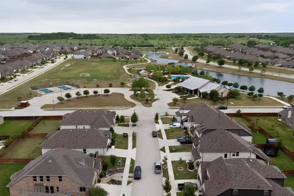 an aerial view of residential houses with outdoor space