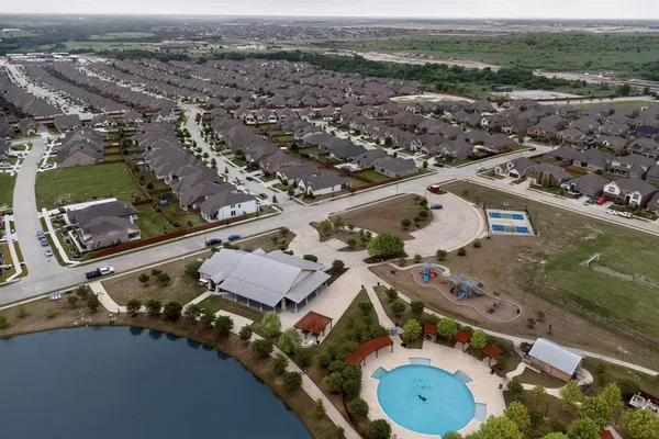 an aerial view of residential houses with outdoor space