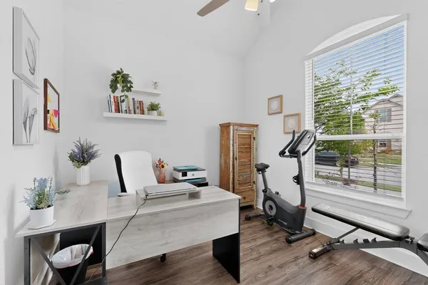 a living room with furniture a air conditioner and a window