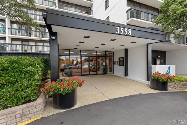 a front view of a building with flowers