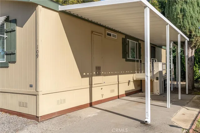 a view of a house with car parked