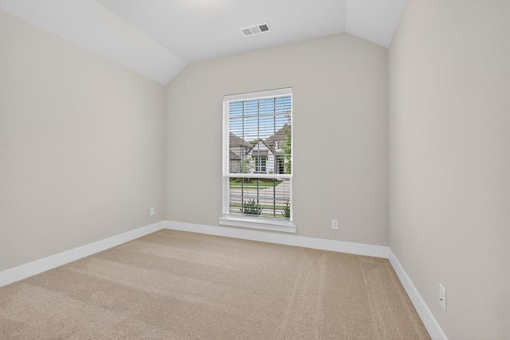 4123 Windy Point Court Oak Point, TX 75068 - Photo 19 of 29 Neutral tone carpeted room featuring a single window with blinds