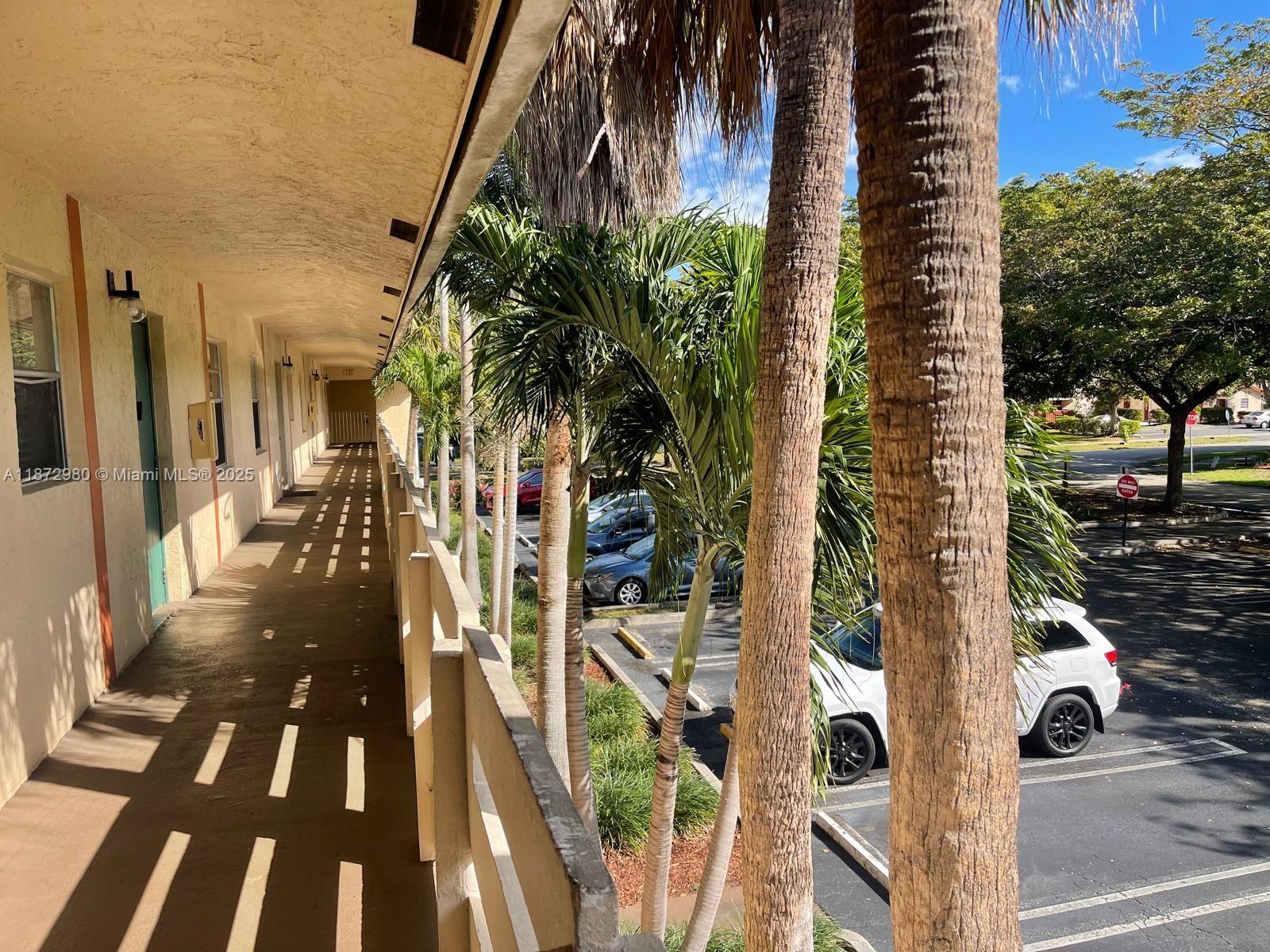 3224 Northwest 103rd Terrace, Unit 205B Coral Springs, FL 33065 - Photo 1 of 21 a view of outdoor space with seating area