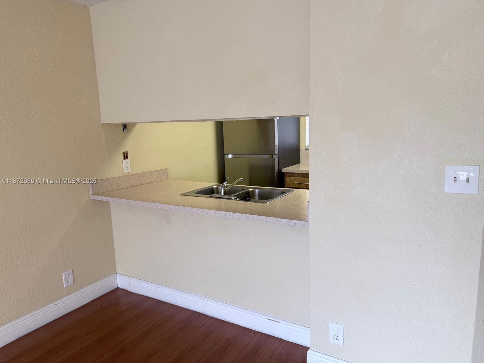3224 Northwest 103rd Terrace, Unit 205B Coral Springs, FL 33065 - Photo 13 of 21 a hallway with a sink