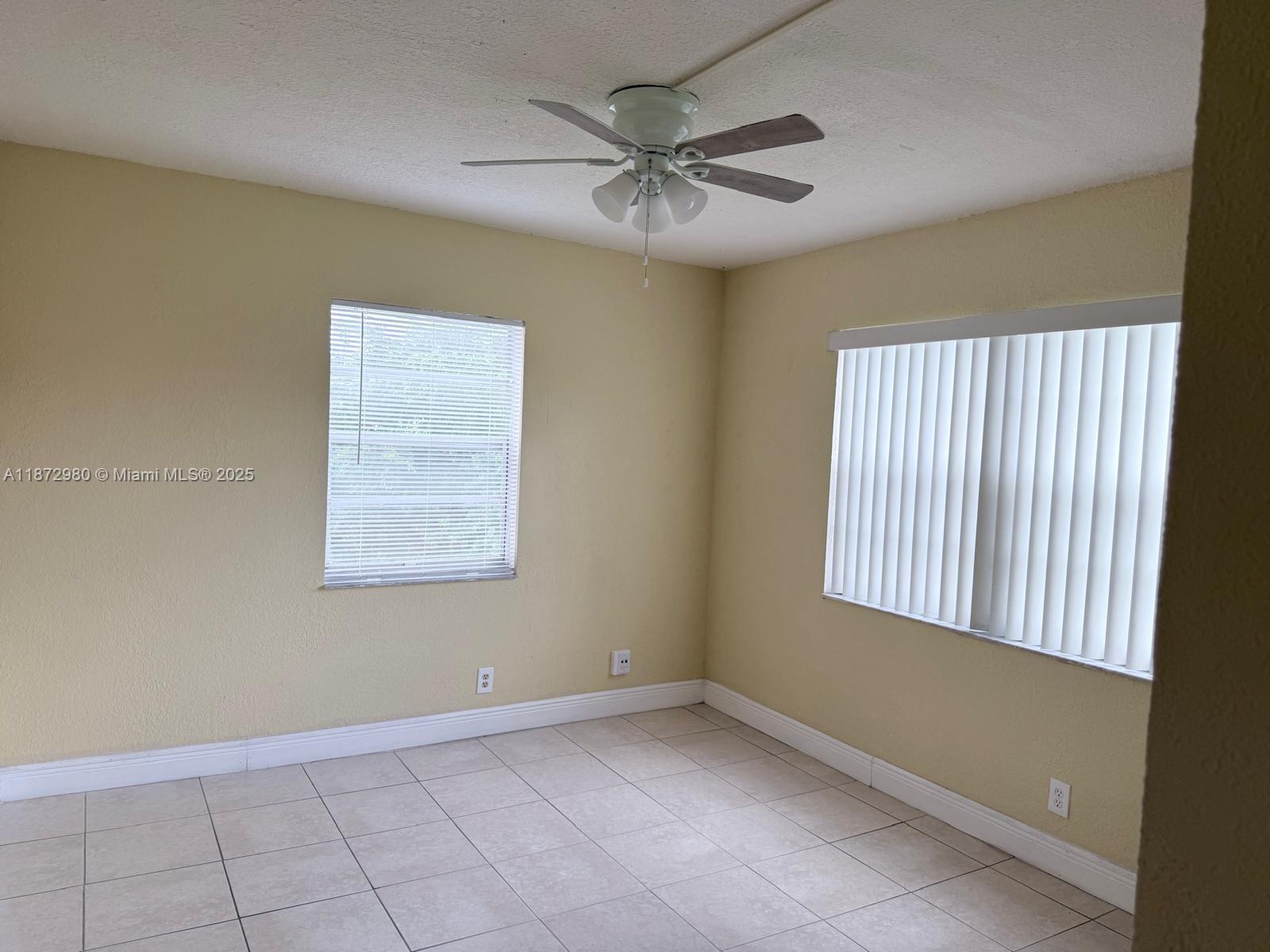 3224 Northwest 103rd Terrace, Unit 205B Coral Springs, FL 33065 - Photo 14 of 21 a view of an empty room with a window