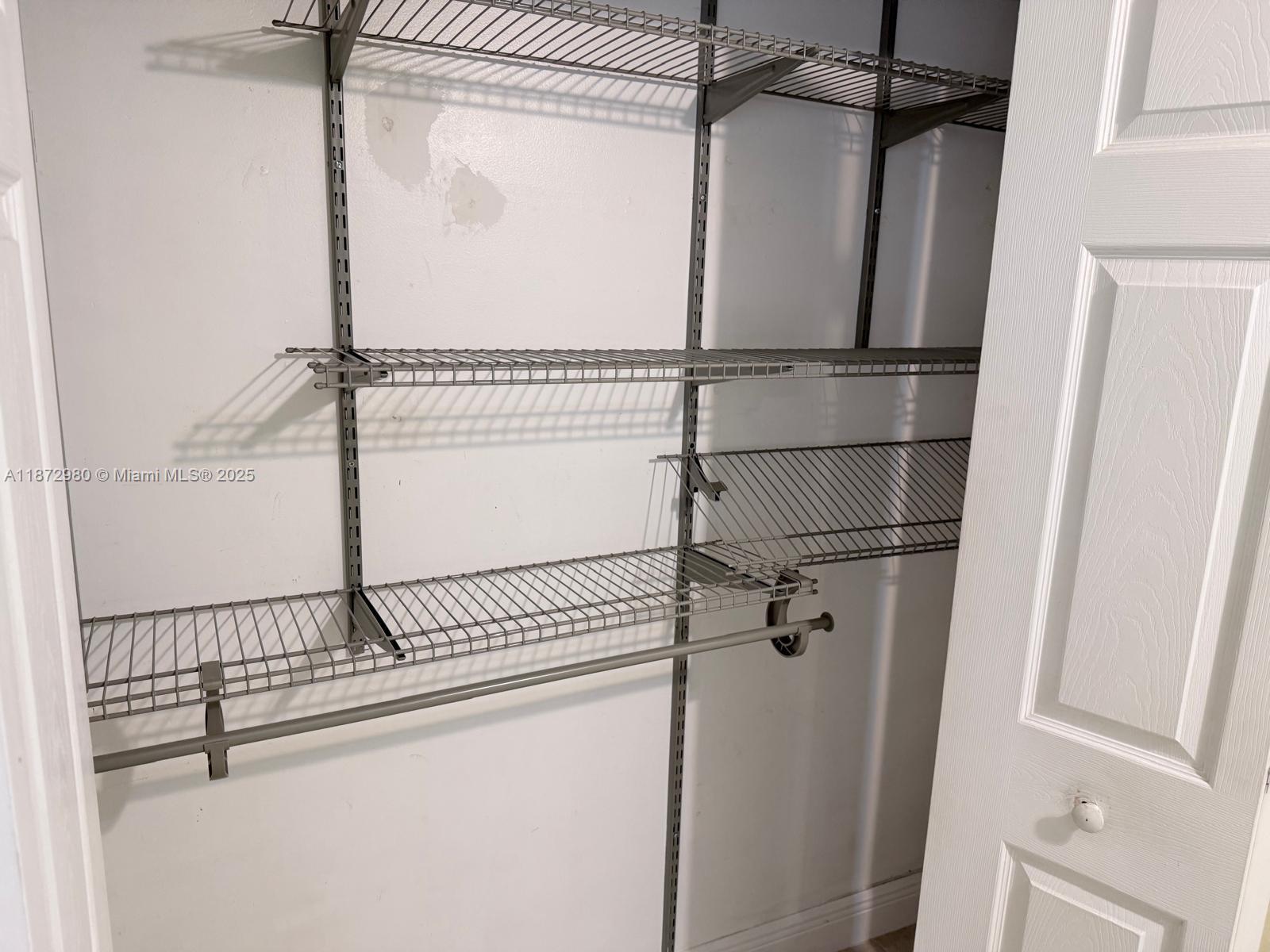 3224 Northwest 103rd Terrace, Unit 205B Coral Springs, FL 33065 - Photo 17 of 21 a view of a room with rack on the wall