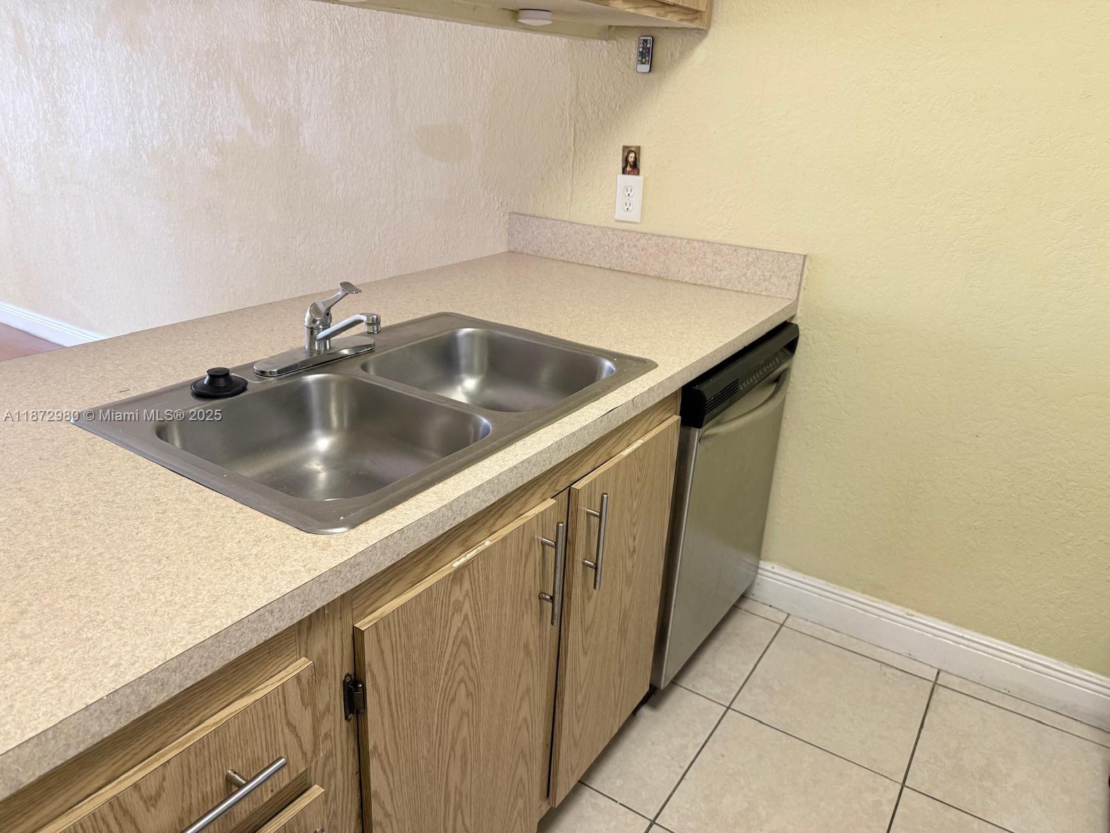 3224 Northwest 103rd Terrace, Unit 205B Coral Springs, FL 33065 - Photo 20 of 21 a close view of sink and tap