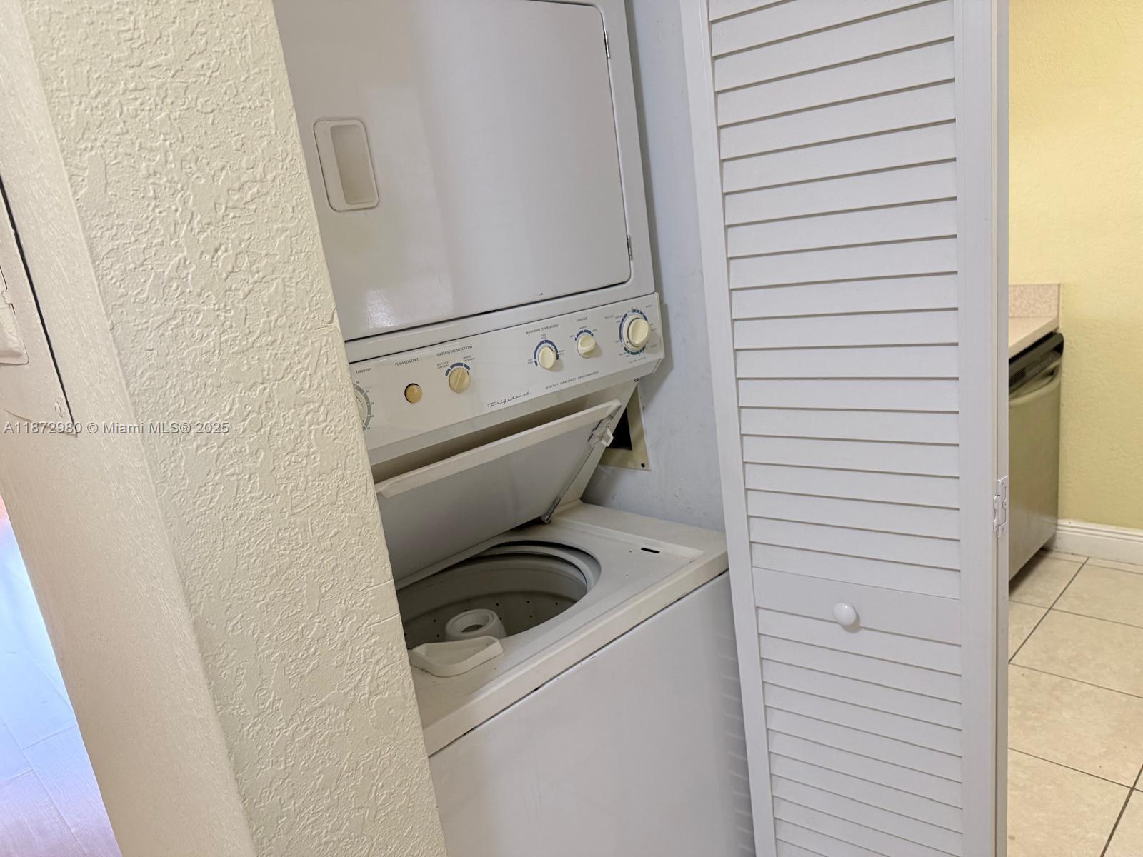 3224 Northwest 103rd Terrace, Unit 205B Coral Springs, FL 33065 - Photo 21 of 21 a utility room with dryer and washer
