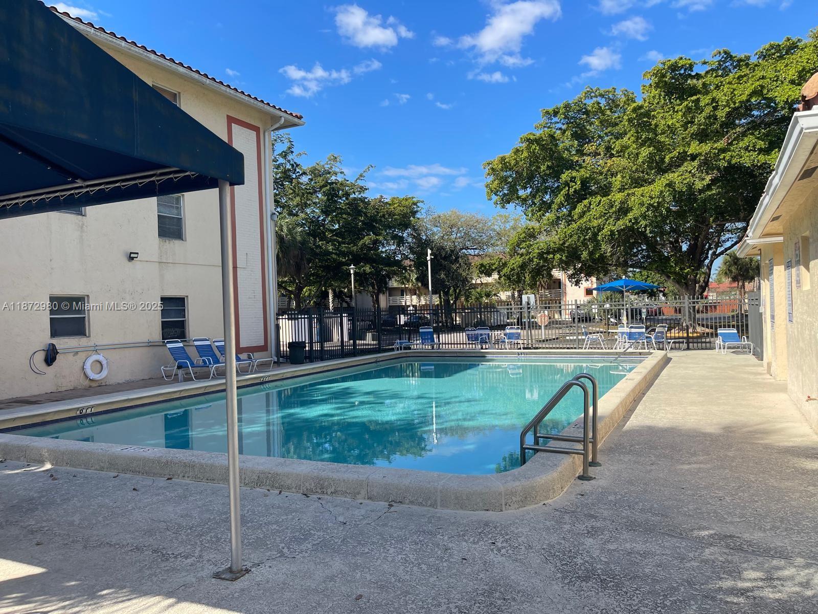 3224 Northwest 103rd Terrace, Unit 205B Coral Springs, FL 33065 - Photo 3 of 21 a view of a park with slide