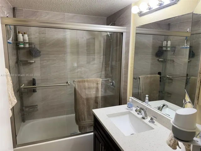 a bathroom with a bathtub and a sink