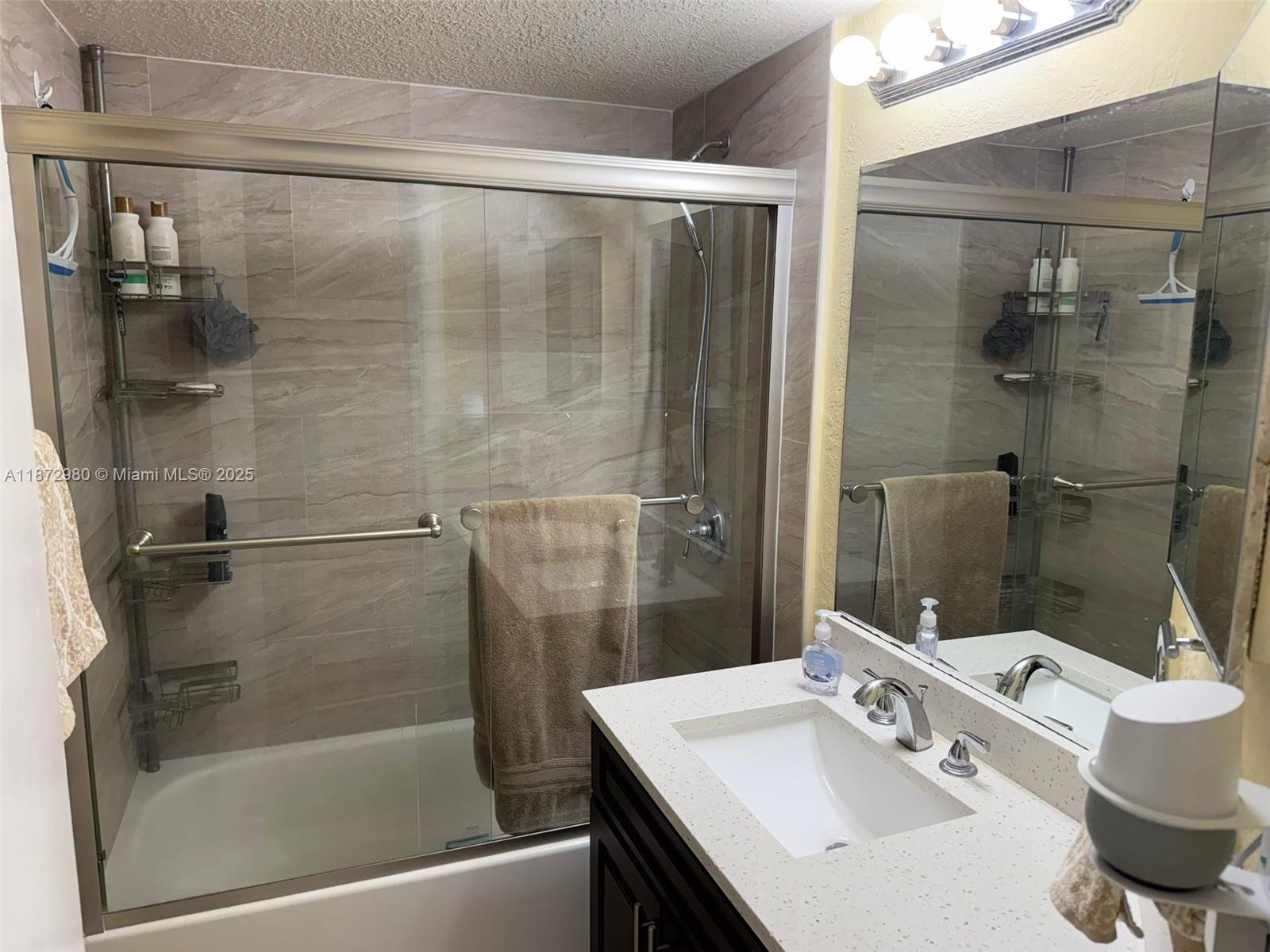 3224 Northwest 103rd Terrace, Unit 205B Coral Springs, FL 33065 - Photo 5 of 21 a bathroom with a bathtub and a sink