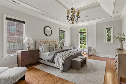 a bedroom with furniture and a window
