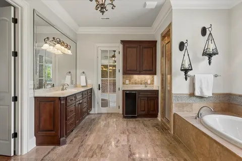 a bathroom with a bathtub and a shower