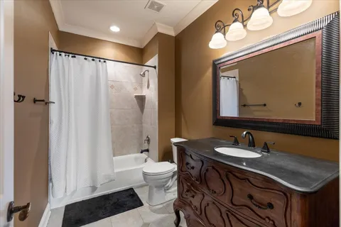 a room with pool table and flat screen tv