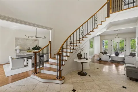a view of entryway and hall with dining room