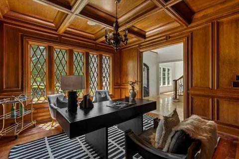 a dining room with furniture and chandelier