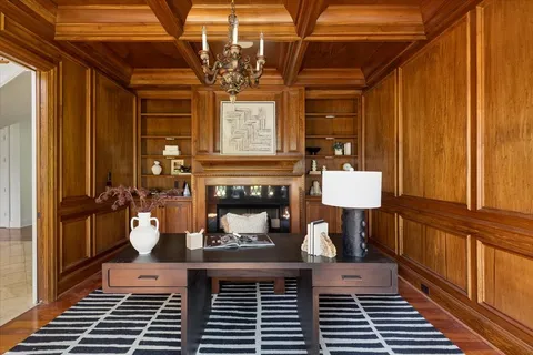 a kitchen with center island table and chairs