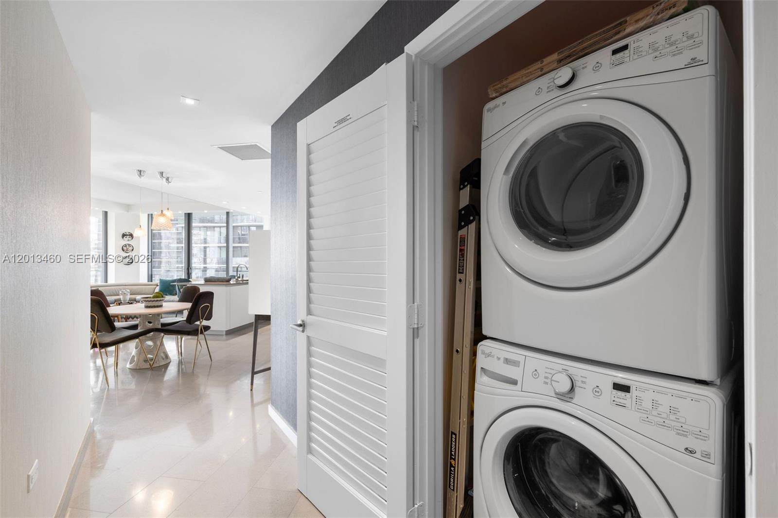 88 Southwest 7th Street, Unit 1201 Miami, FL 33130 - Photo 16 of 39 a view of a living room with washer and dryer