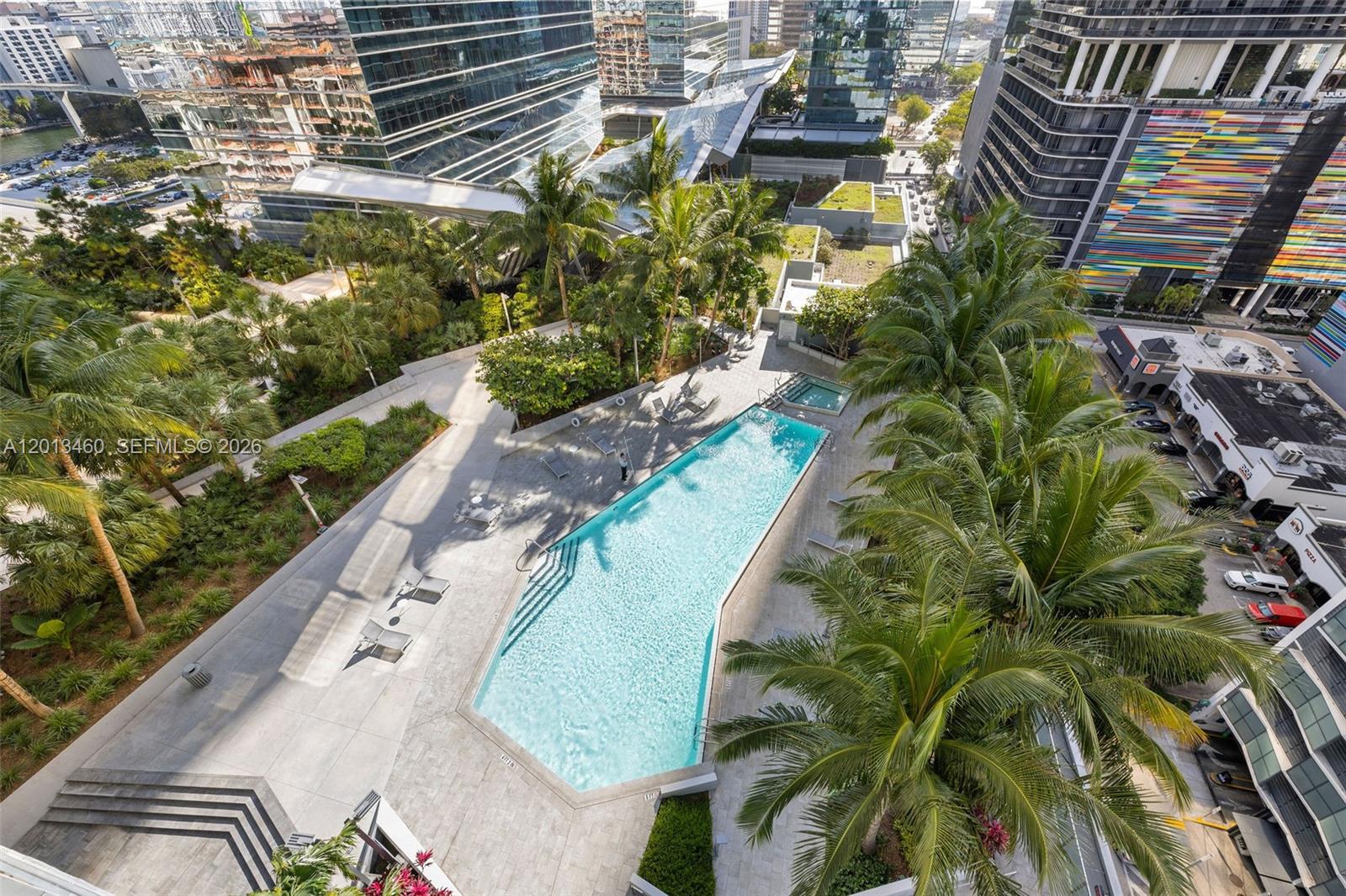88 Southwest 7th Street, Unit 1201 Miami, FL 33130 - Photo 2 of 39 a view of a swimming pool with a patio