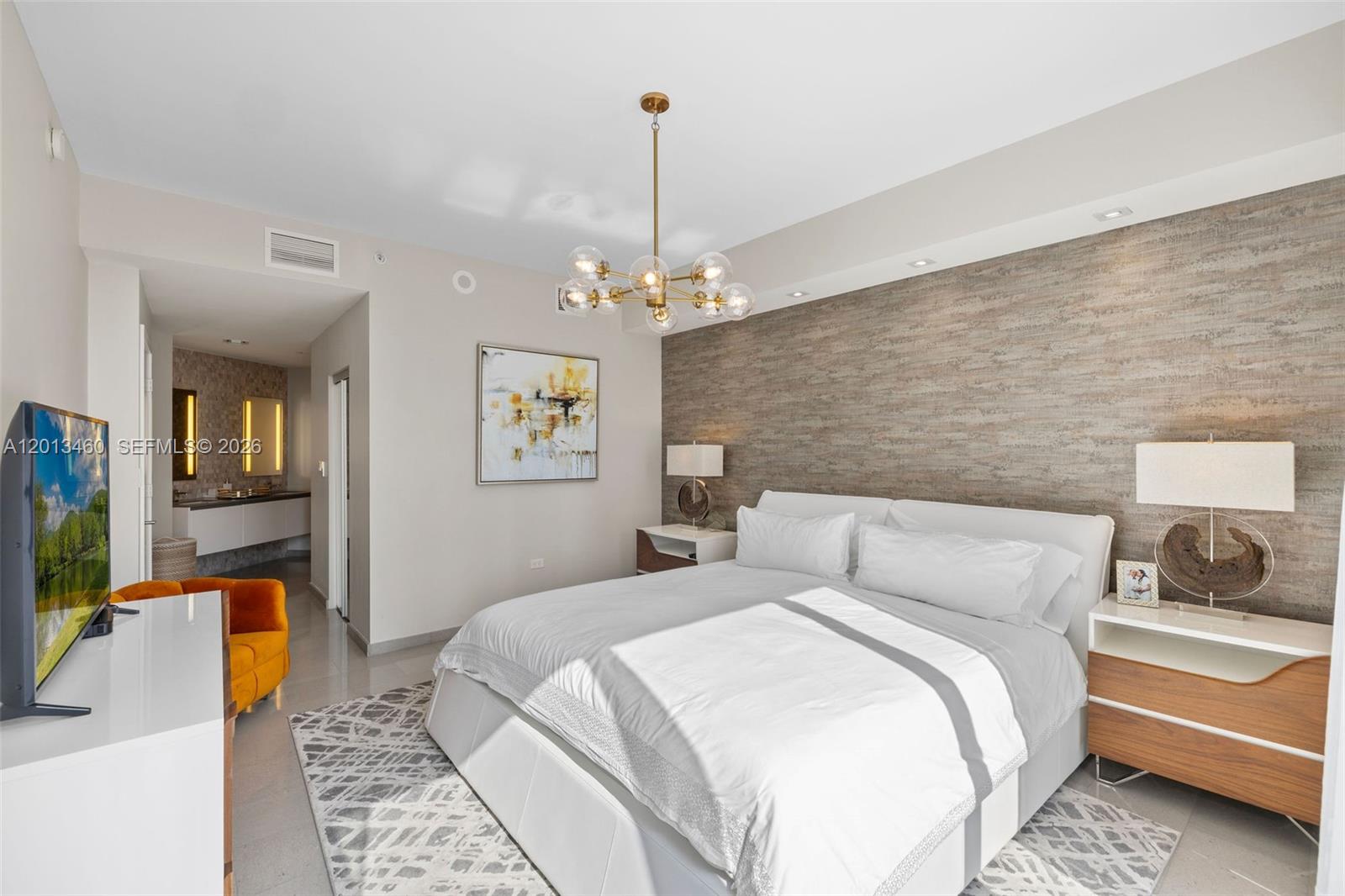 88 Southwest 7th Street, Unit 1201 Miami, FL 33130 - Photo 30 of 39 a bedroom with a bed and a couch