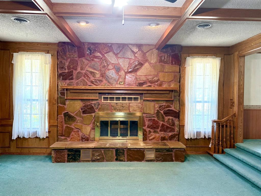 1537 Burns City Road Gainesville, TX 76240 - Photo 6 of 27 a living room with furniture and a fireplace