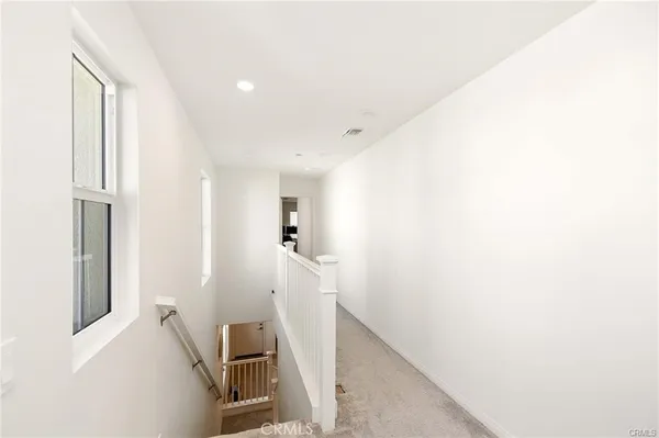 a view of a hallway with workspace