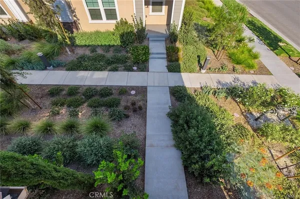 an aerial view of a house with a garden