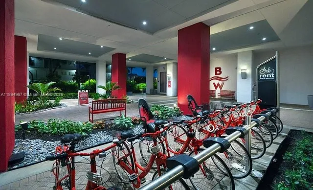 a group of people sitting in front of a house