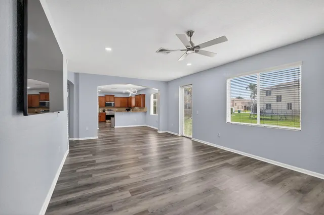 a kitchen with stainless steel appliances a refrigerator stove and microwave