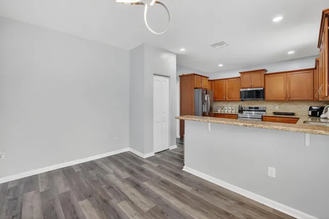 a view of a livingroom with furniture and a potted plant