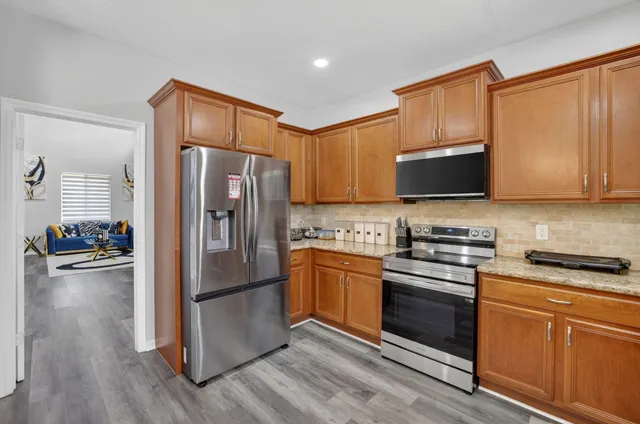a bathroom with a tub a sink and mirror