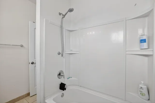 a view of a backyard with plants and a garden