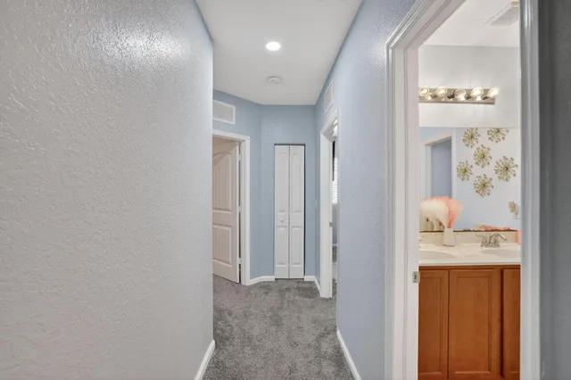 an aerial view of house with yard and lake view in back