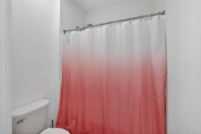 an aerial view of residential houses with outdoor space and street view