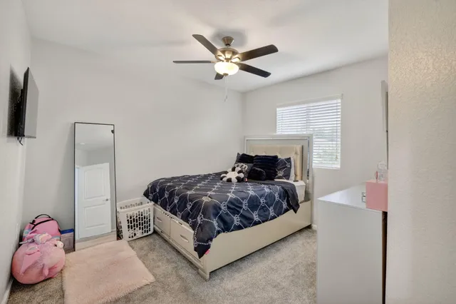 an aerial view of residential houses with outdoor space
