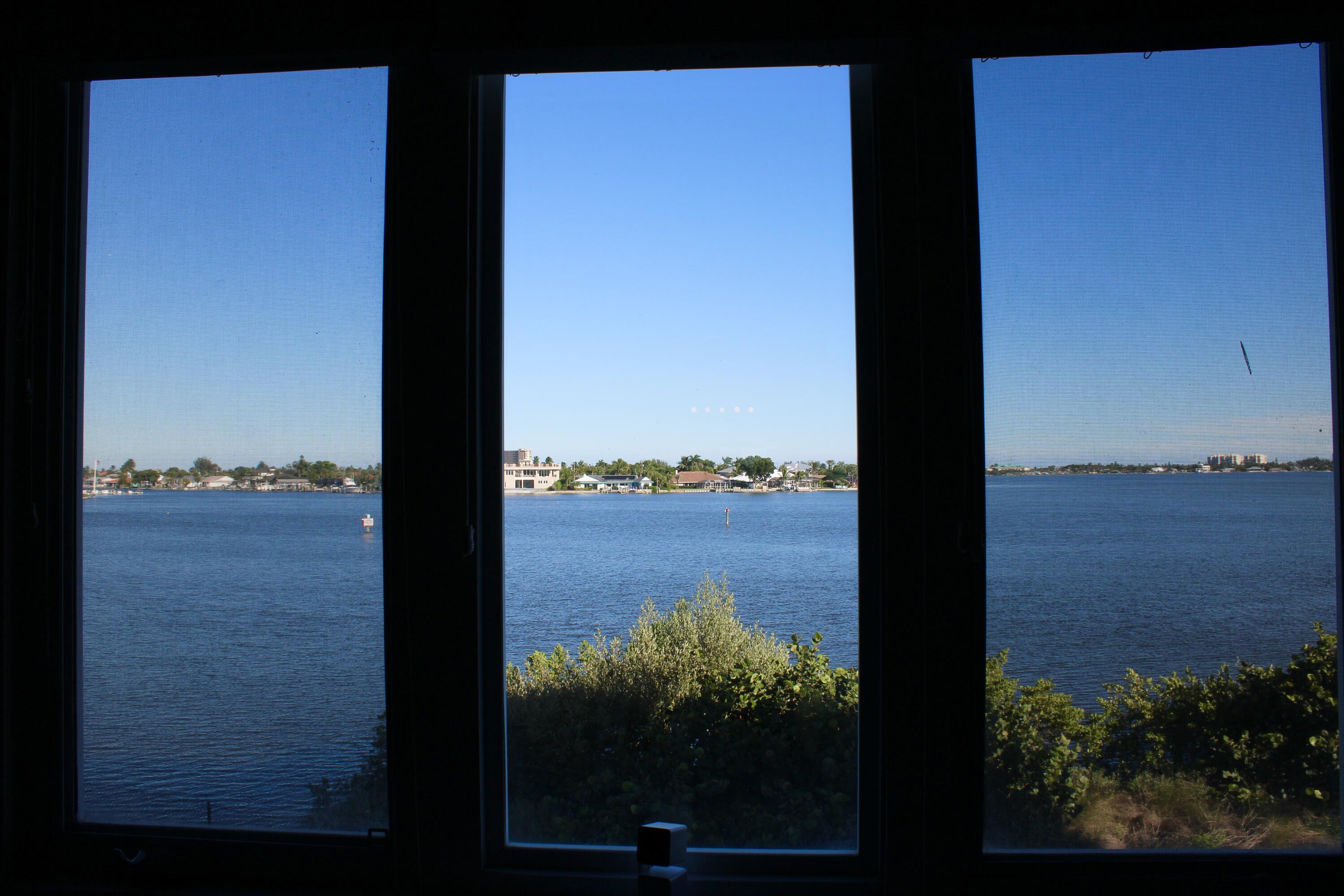 3 Harbour Isle Drive East, Unit 204 Fort Pierce, FL 34949 - Photo 12 of 21 a view of a lake from a balcony
