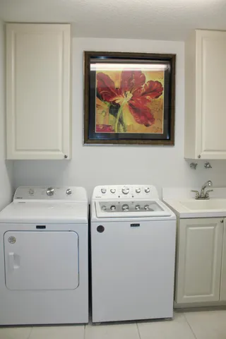 a utility room with dryer and washer