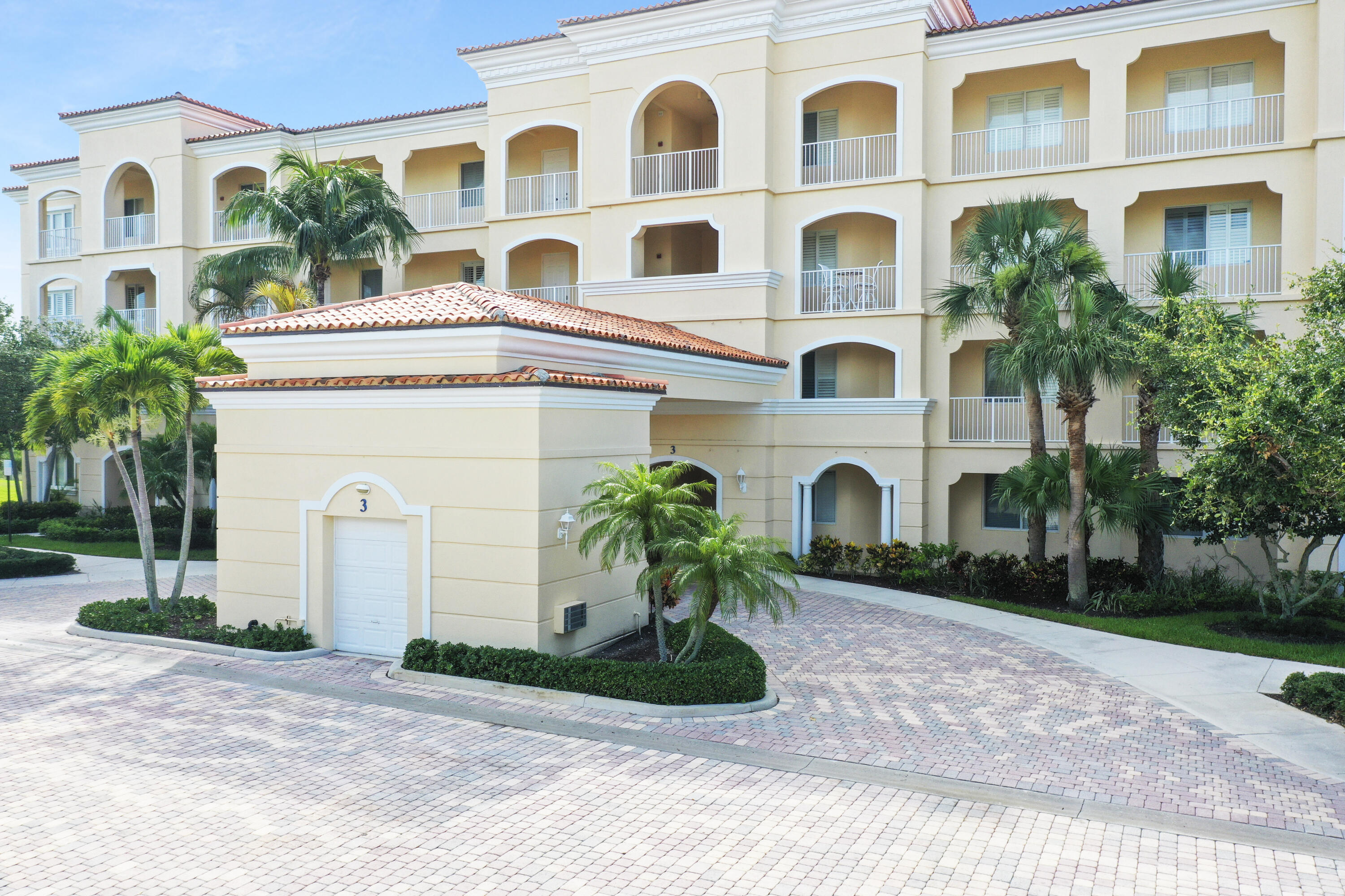 3 Harbour Isle Drive East, Unit 204 Fort Pierce, FL 34949 - Photo 20 of 21 a front view of a multi story building with yard