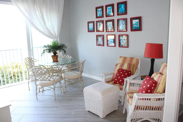 a living room with furniture and a book shelf
