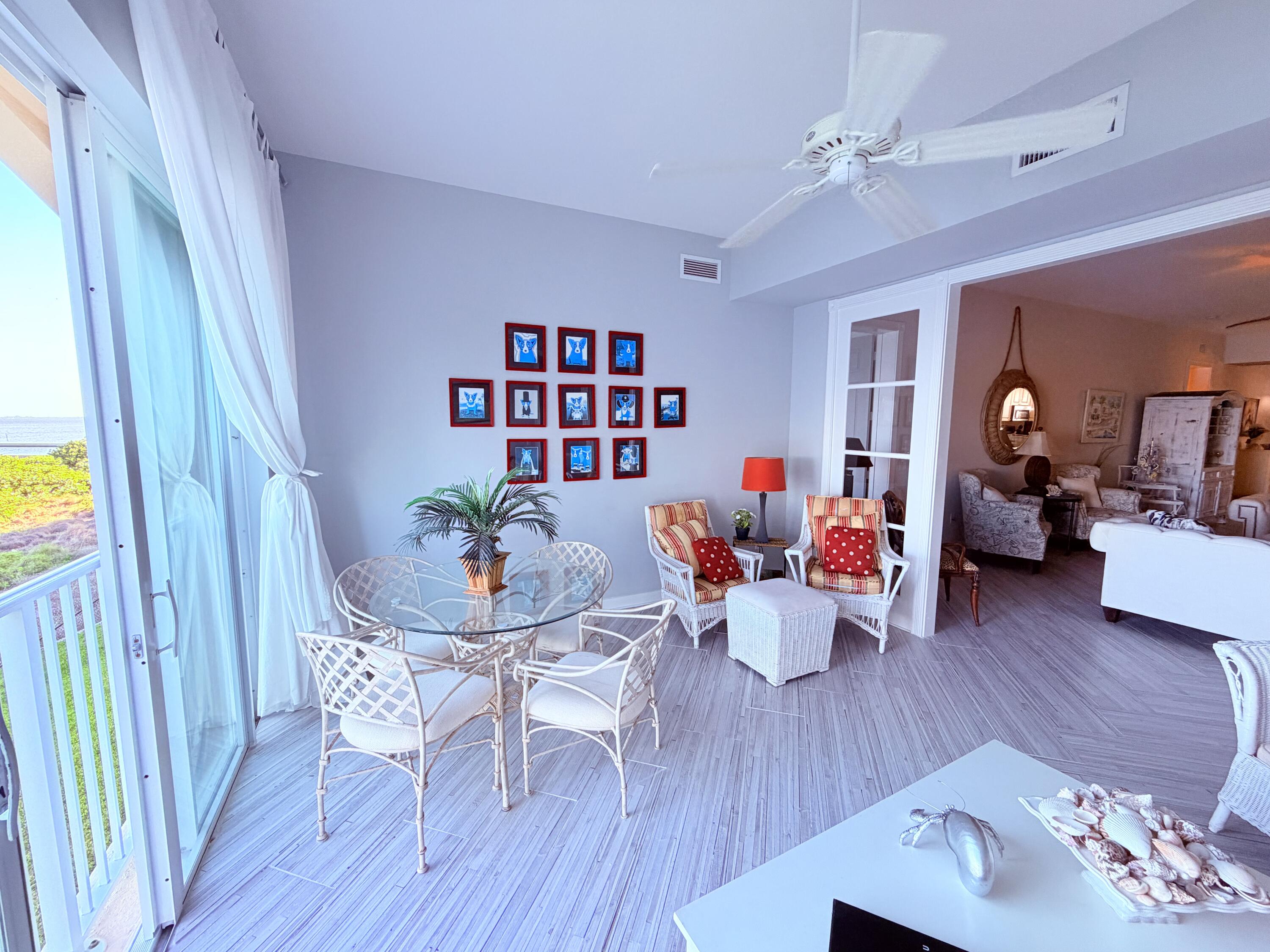 3 Harbour Isle Drive East, Unit 204 Fort Pierce, FL 34949 - Photo 4 of 21 a living room with furniture and wooden floor