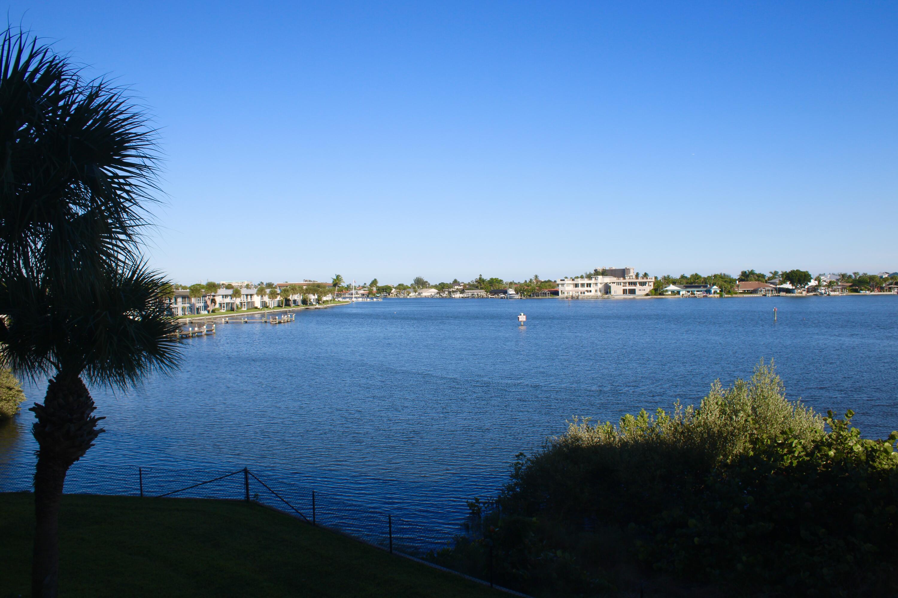 3 Harbour Isle Drive East, Unit 204 Fort Pierce, FL 34949 - Photo 6 of 21 a view of a lake and houses in the back