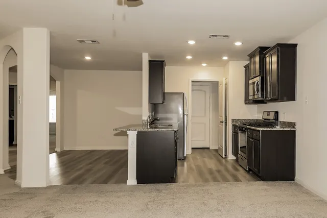 a view of an empty room with a window