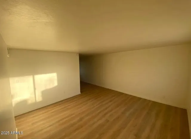 a view of an empty room and window