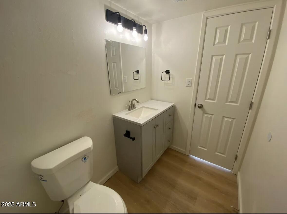 704 West 11th Street Casa Grande, AZ 85122 - Photo 9 of 10 a white toilet sitting next to a bathroom sink