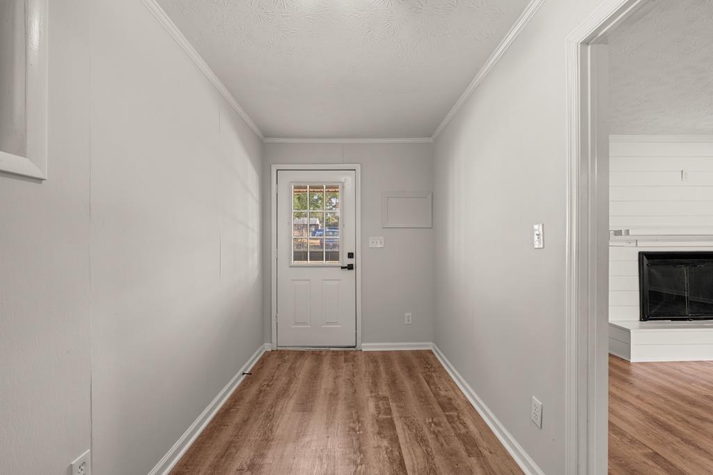 2312 Burnside Drive Columbus, GA 31907 - Photo 12 of 25 a view of a room with wooden floor and a hallway