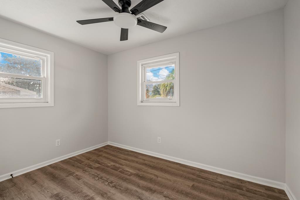 2312 Burnside Drive Columbus, GA 31907 - Photo 20 of 25 a view of an empty room with wooden floor and a window