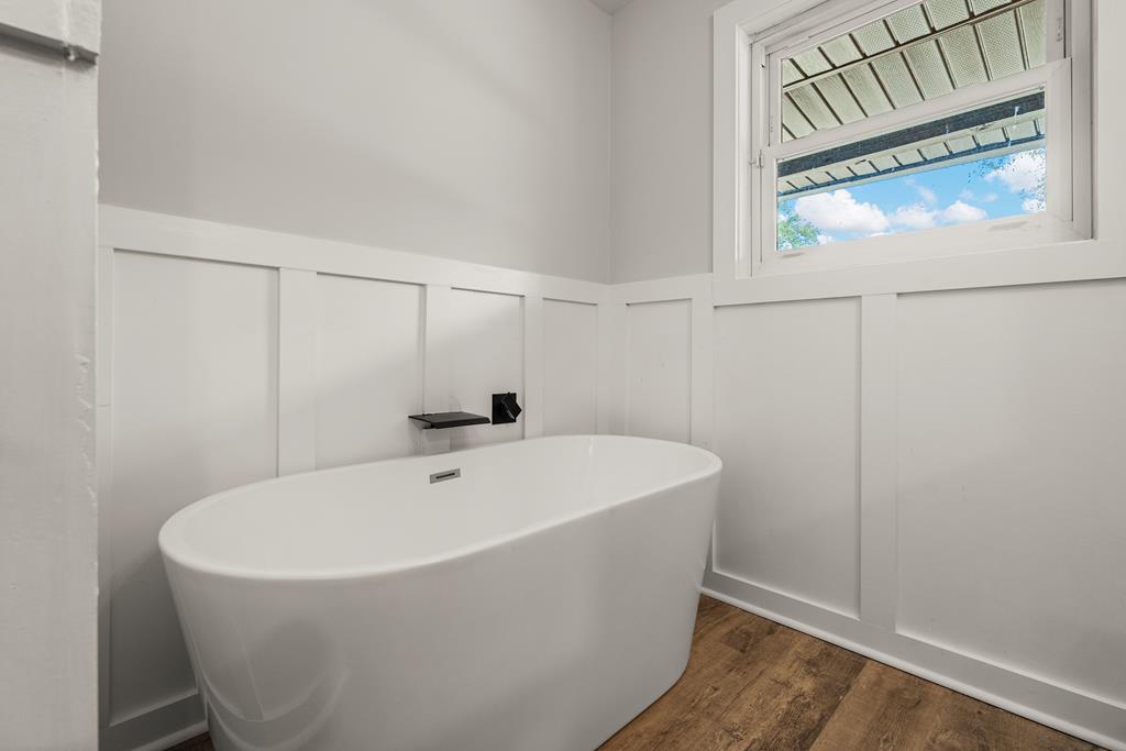 2312 Burnside Drive Columbus, GA 31907 - Photo 21 of 25 a white bath tub sitting under a bathroom